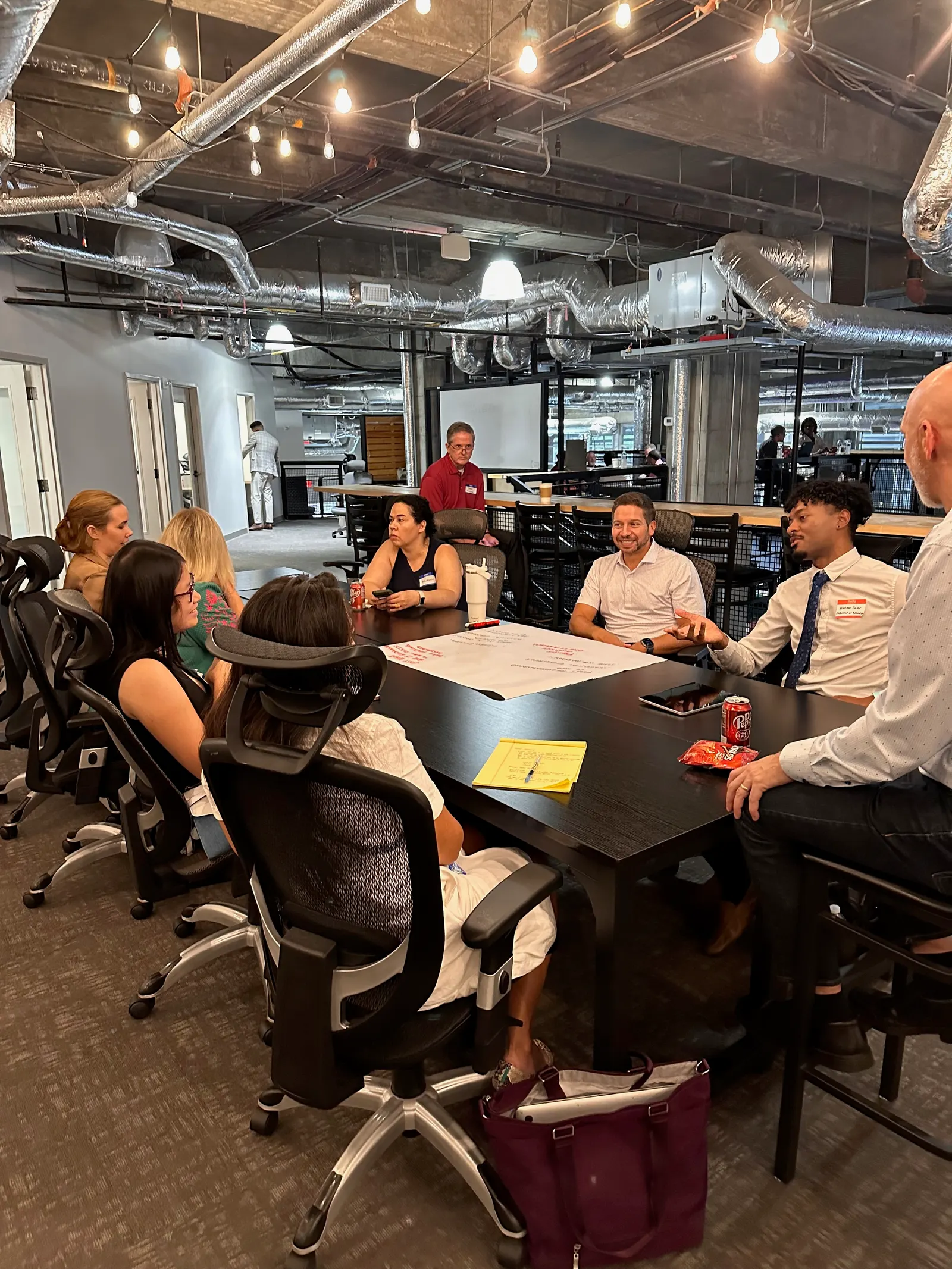Founders working around a table during a Founder Central Startup Solves session.